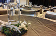 Large glass water filled centrepieces with flora