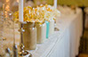 Wedding decorator with mason jars and candles
