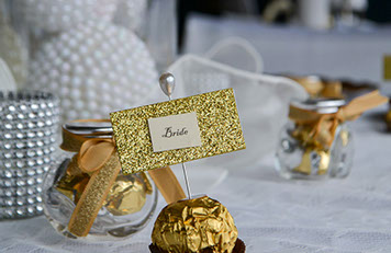 Wedding Decorator Bride event photo with white and chrome accents on a table